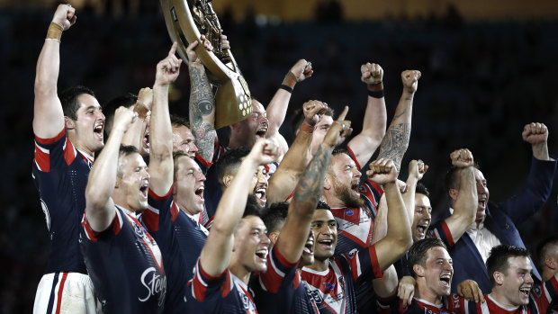 The Roosters lift the NRL trophy for the second time in as many years.