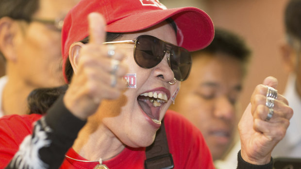 A supporter of the Pheu Thai party at party headquarters in Bangkok on Sunday.