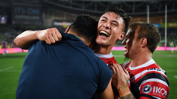 Joey Manu celebrates a second straight premiership with the Roosters in 2019.