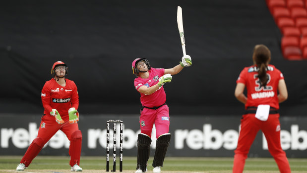 Hit out: Sixers' Alyssa Healy cuts loose during the win over Melbourne Renegades at GIANTS Stadium in Sydney.