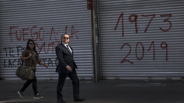 The shop at right has 2019 written under the year of Chile's military coup by dictator Augusto Pinochet in 1973. 