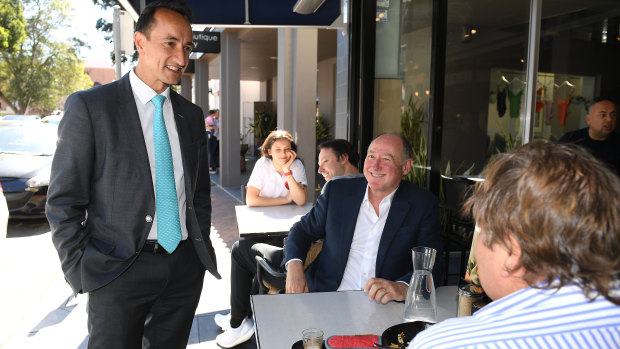 Dave Sharma speaks to locals at a Double Bay cafe on Friday. 