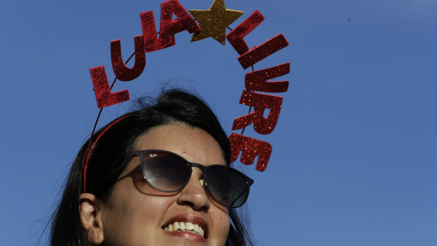 A supporter of the jailed former president  wears a "Free Lula" headpiece outside Brazil's Supreme Court in Brasilia on Thursday.