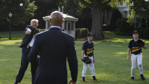 Donald Trump plays catch with former Yankees Hall of Fame pitcher Mariano Rivera as he greets youth baseball players on the South Lawn of the White House last Thursday.