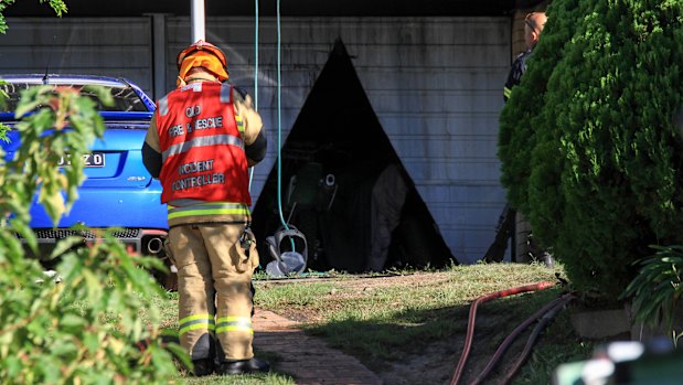 Firefighters had to cut their way into the garage.