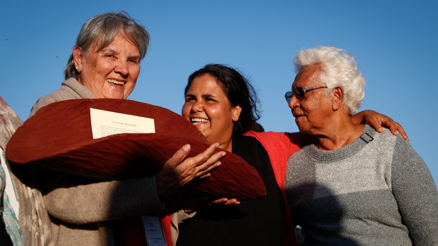 Pat Anderson, Sally Scales and Irene Davey are pictured in May 2017 holding a piti with the Uluru Statement from the Heart.