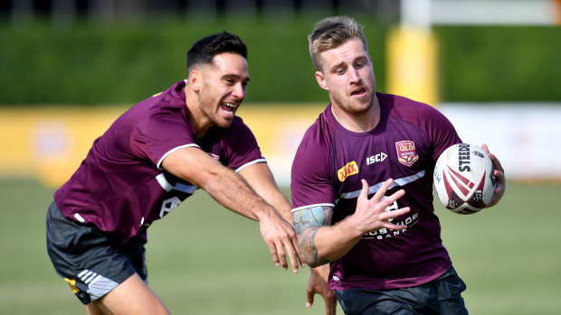 Cameron Munster (right) will line up at fullback for the Maroons in game three in Sydney, with Corey Norman in the halves.