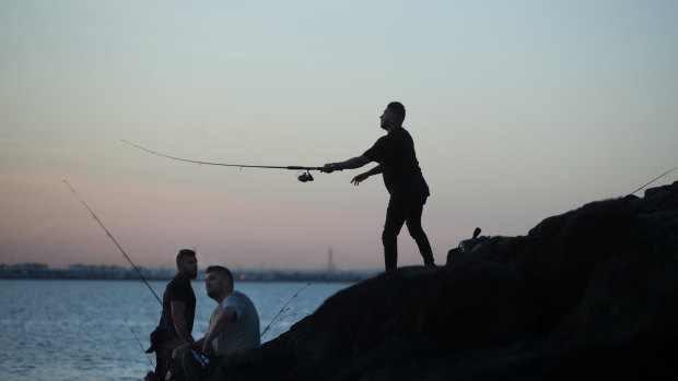 Fishers on the end of St Kilda pier.