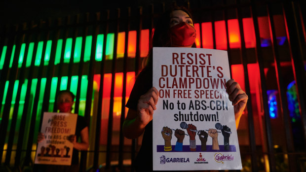 Supporters and journalists gather outside the broadcaster after the shutdown on Tuesday.