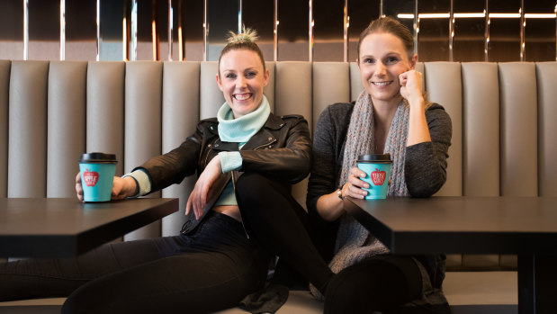 Lauren Davie (left) and Elena Andoniou haven't noticed an impact from the company tax cut. 
