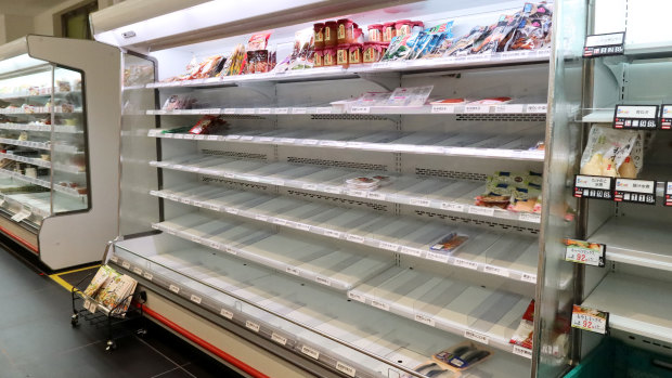 Supermarket shelves have been cleared out as people prepare for Typhoon Hagibis in Yokohama. 