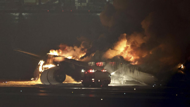 A Japan Airlines plane catches fire on the runway at Haneda Airport in Tokyo.