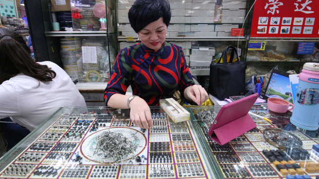 A shop owner at the electronics and comupter market in Shenzhen’s Huaqiangbei.