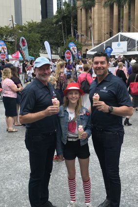 Prince Charles Hospital Foundation CEO Michael Hornby and journalist Bill McDonald with Madeleine, the daughter of strawberry growers.