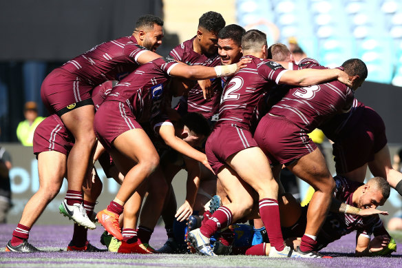 Manly players celebrate after Keith Titmuss’ late try against the Eels in the 2017 NYC grand final.