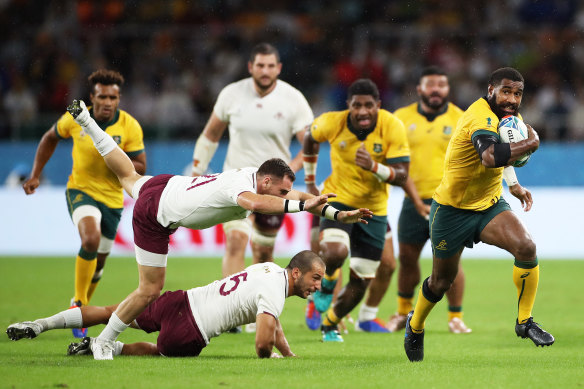 Marika Koroibete of Australia breaks through Soso Matiashvili and Vasil Lobzhanidze of Georgia to go on and score his team’s second try during the Rugby World Cup 2019 Group D game between Australia and Georgia.