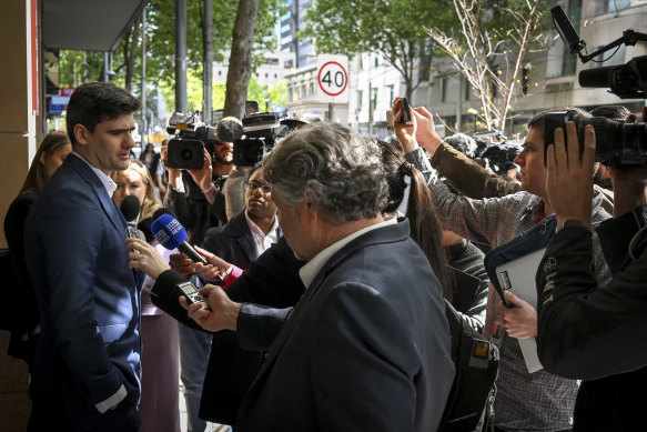 Hersant (left) speaks to the media outside court after his conviction.