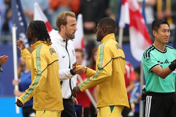 Unfair spotlight? Harry Kane shakes hands with Thomas Partey before England’s World Cup group meeting with Ghana.