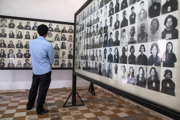 A wall of photographs of prisoners of the Khmer Rouge regime in one of the rooms of Tuol Sleng prison, also known as S-21.