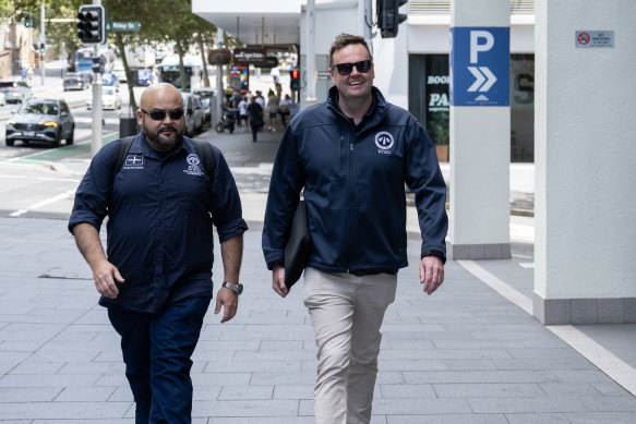 Rail Tram and Bus Union state secretary Toby Warnes, right, arrives at the closed hearing on Monday.