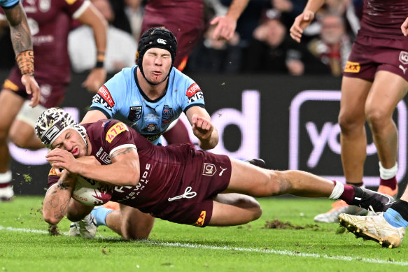Kalyn Ponga crashes over for the Maroons.