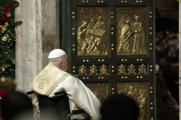 Pope Francis opens the Holy Door to mark the opening of the 2025 Catholic Holy Year, or Jubilee, in St Peter’s Basilica, at the Vatican on Christmas Eve.
