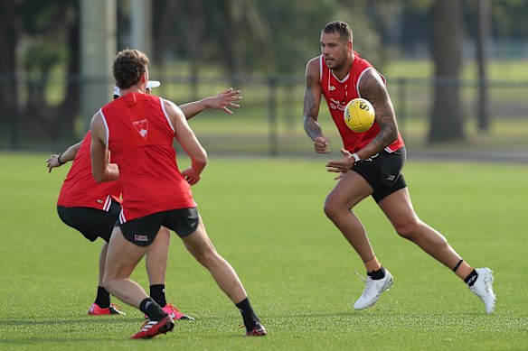 Lance Franklin handballs during Swans training on Monday morning.