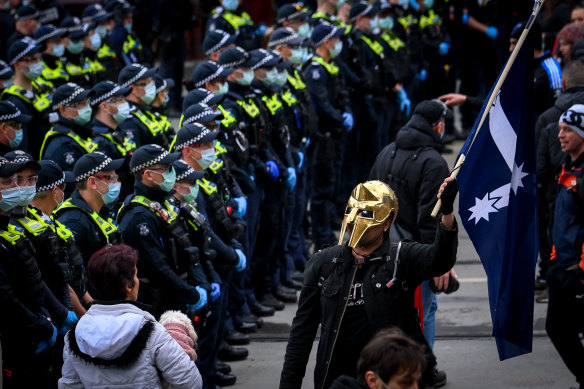 A police line forms at a lockdown protest in Melbourne’s CBD.