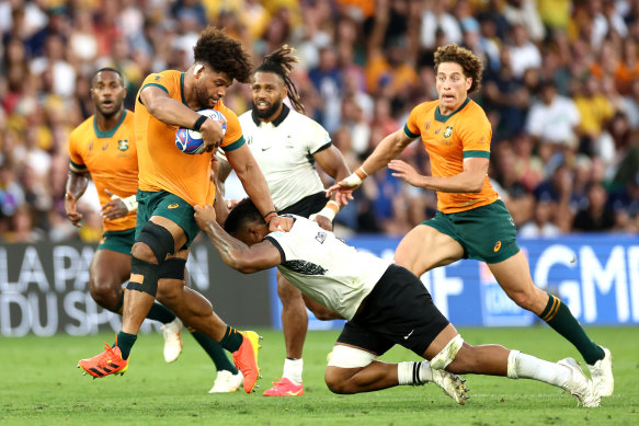 Australia’s Rob Valentini is tackled by Te Ahiwaru Cirikidaveta of Fiji.