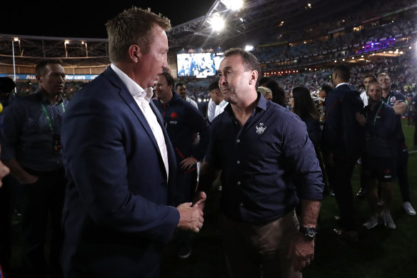 Roosters coach Trent Robinson and Raiders coach Ricky Stuart chat after last year's grand final.