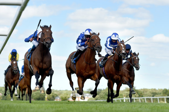 Aspetar, middle, running second at Sandown Park Racecourse in England in July.