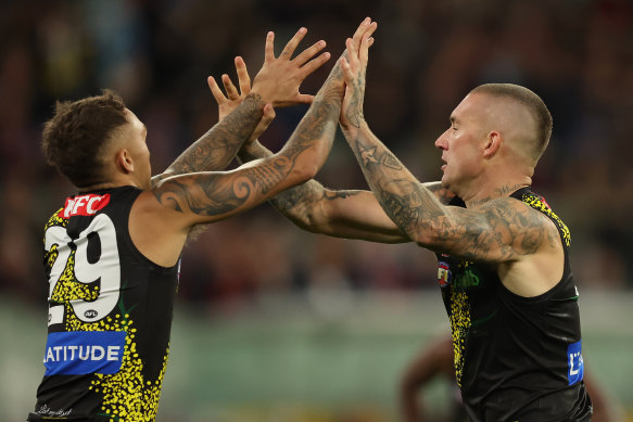 Tigers celebrate a goal.