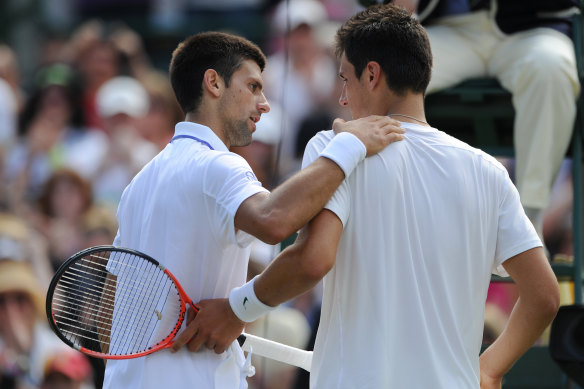 Novak Djokovic consoles Bernard Tomic after a four set victory against the then 18-year-old in the quarter finals at Wimbledon in 2011.