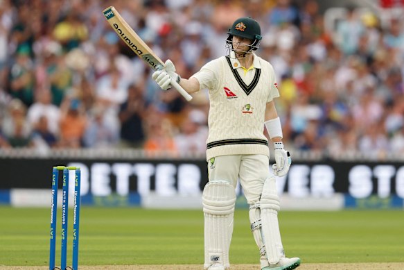 Smith raises his bat. 