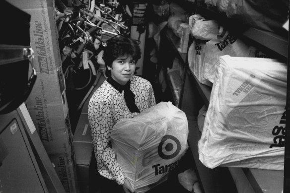 Staffer Isabel McDonald of Target in Burwood with the Lay-By room clock full of Christmas orders in 1989.