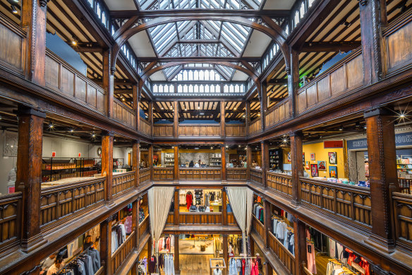 The interior of Liberty, a prestige London department store housed in a Tudor-revival style building.