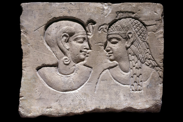 Relief of a mother, possibly a queen, and her son, on show as part of the Pharaoh exhibition at NGV.
