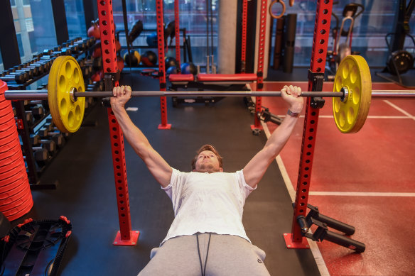 Physiotherapist Luke Pickett performing a bench press.