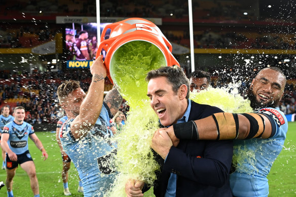 NSW coach Brad Fittler cops the Gatorade salute after the Blues’ win in Brisbane.