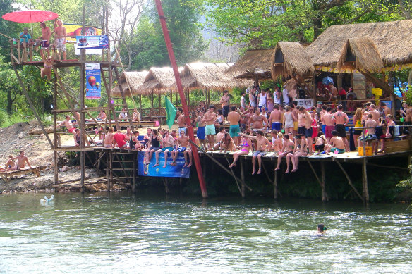 Australian tourists wait to go tubing in Vang Vieng in Laos, 2012.