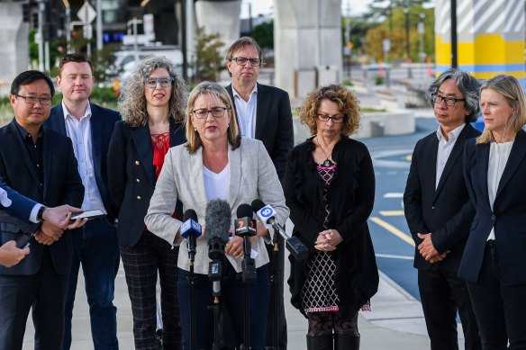 Transport Infrastructure Minister Jacinta Allan, with her backbench colleagues and Nicole Stoddart from the Suburban Rail Loop Authority (far right), providing an update on the underground line at Clayton station. 