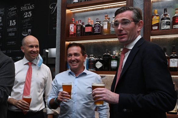 NSW Premier Dominic Perrottet with Deputy Premier Paul Toole (middle) and NSW Treasurer Matt Kean (left) enjoying a beer at a Sydney pub earlier this morning.