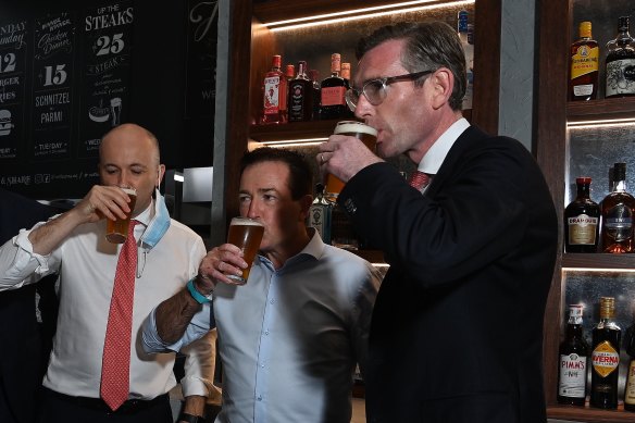 NSW Premier Dominic Perrottet enjoys a beer with Deputy Premier Paul Toole and Treasurer Matt Kean at Watson’s Pub in Moore Park.