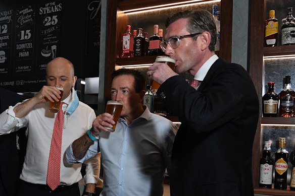 NSW Premier Dominic Perrottet enjoys a beer with Deputy Premier Paul Toole and Treasurer Matt Kean at Watson’s Pub in Moore Park.