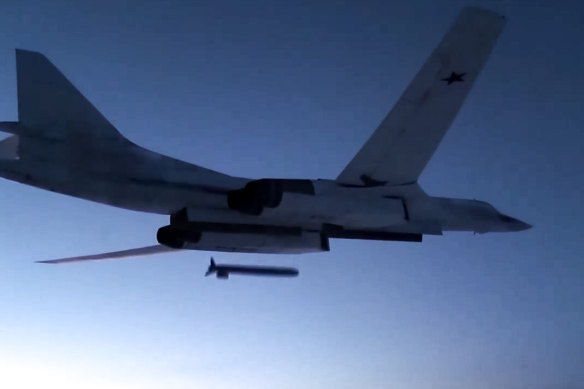 A Russian Tu-160 strategic bomber fires a cruise missile at test targets, during a military drills, Russia. 