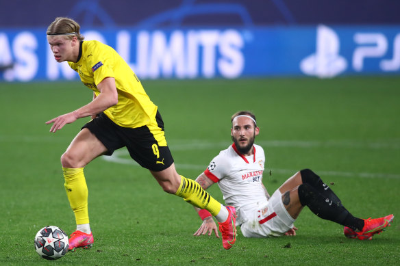 Erling Haaland gets away from Sevilla’s Nemanja Gudelj during Borussia Dortmund’s Champions League win over the Spaniards.