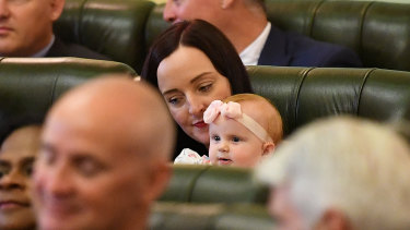 The Member for Keppel Brittany Lauga is seen with her baby daughter Odette on the opening day of the 56th Queensland Parliament