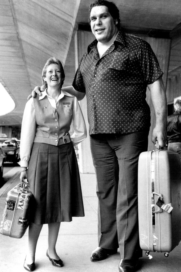 Andre the Giant and Qantas senior passenger agent, Jane Symond, on arriving in Sydney on a 1984 visit.