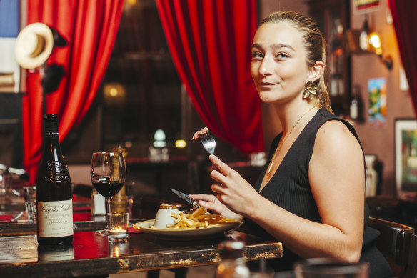 L’Auberge du Bout du Monde staff member Manon Lust samples the steak frites with marchand de vin sauce.