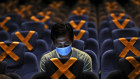 Not too close: social-distancing at a recently reopened cinema in Jakarta, Indonesia. Emerging countries need support. 